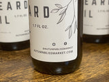 Bottles of beard oil with labels indicating the name of the store, 'Autumn Bliss Market'.