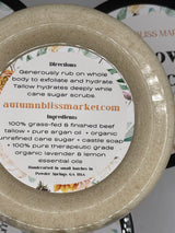 A container of Tallow Body Scrub indicating labelled directions and ingredients.