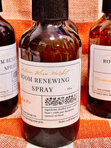 Bottles of Room Renewing Spray showing ingredients.