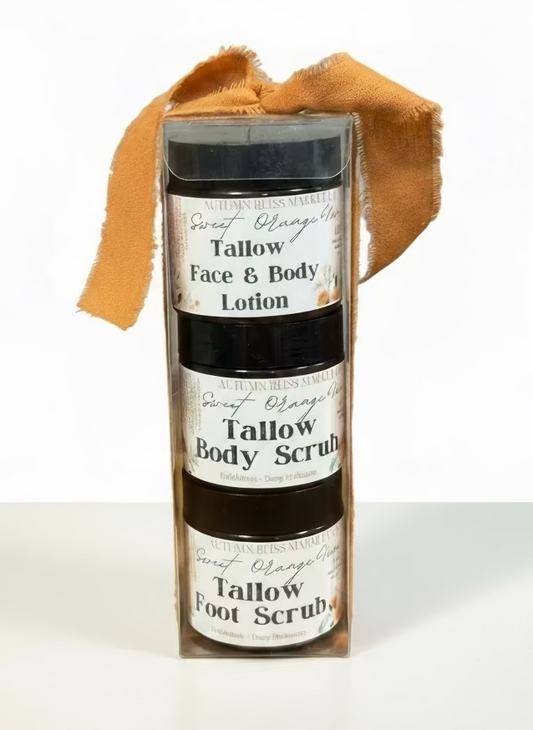 Set of tallow skincare products including lotion, scrub, and foot scrub with a label on a white background.
